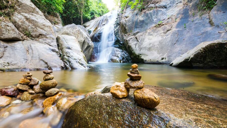 27 Waterfalls Tour with Entrance Fee & Lunch - Hiking through the forest to the river