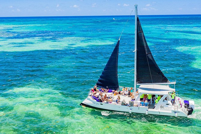Catamaran Cruise with Snorkeling & Parasailing - Parasailing With the Coast Below You