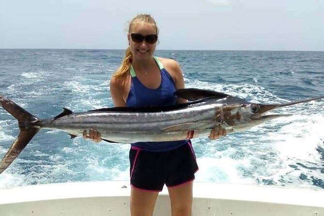 Fishing Adventure Punta Cana – Full Experience Professional - Rum, beer, water, fruit, and chips