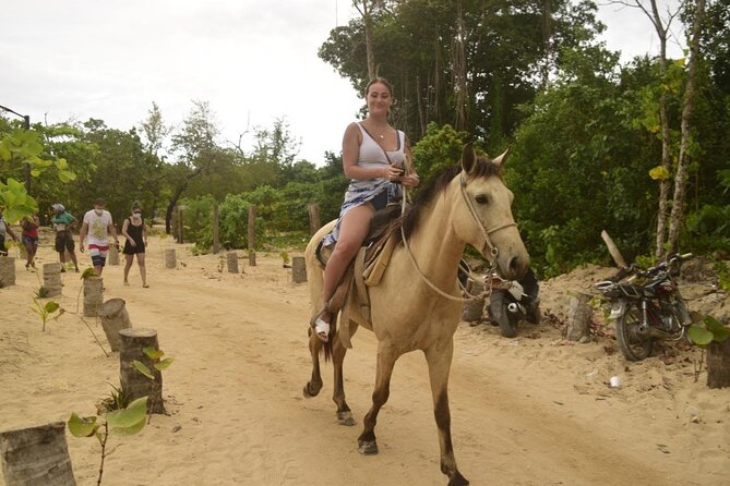 Horseback riding along Macao beach from Punta Cana - Macao Beach, white sand, palms, and local life