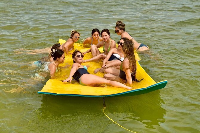 Private Cruise Party and Snorkeling in Punta Cana - Dolphin Island, beach views, and the water slide