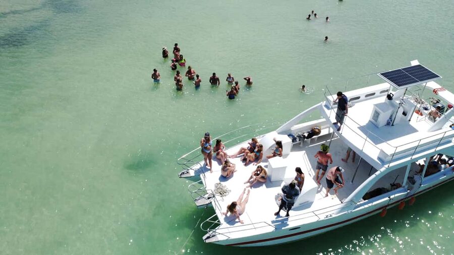 Punta Cana: Booze Cruise with Snorkel and Natural Pool Stop - Music, drinks, and snacks on the catamaran
