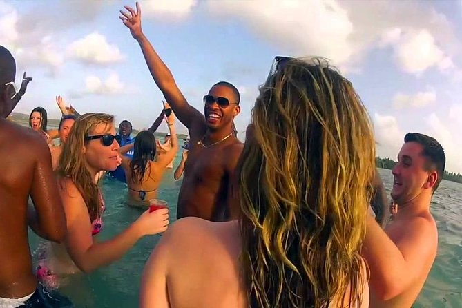 Punta Cana Booze Cruise with Snorkeling, Natural Pool & Open Bar - Leaving Bibijagua Beach with music on deck