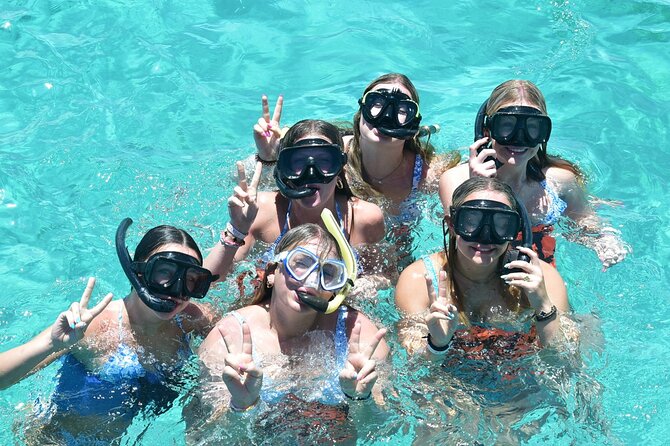 Punta Cana: Catamaran Tour, Reef Snorkeling and Unlimited Drinks! - Boarding a spacious catamaran with a low-key mood