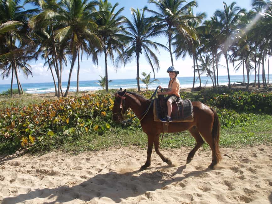 Punta Cana: Horseback Ride to Macao Beach - Riding through a traditional village
