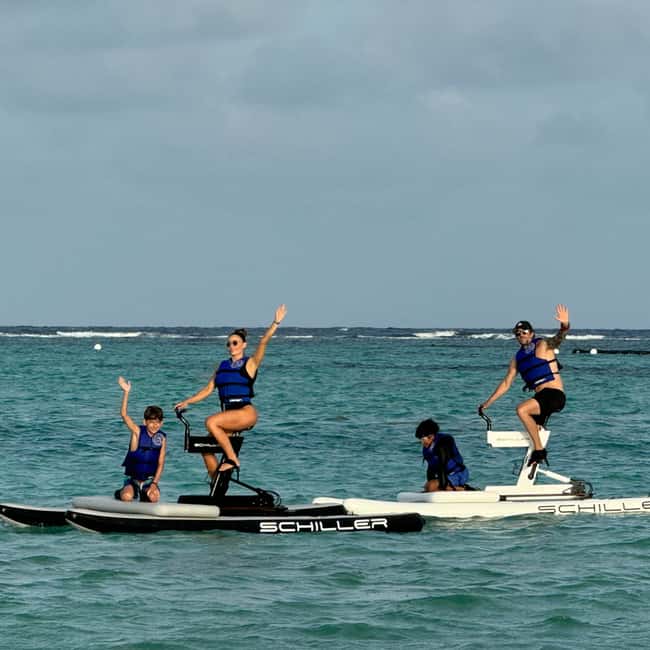 Punta Cana Luxury Snorkel & Beach Club Day at Playa Blanca - Pedaling over calm Caribbean water