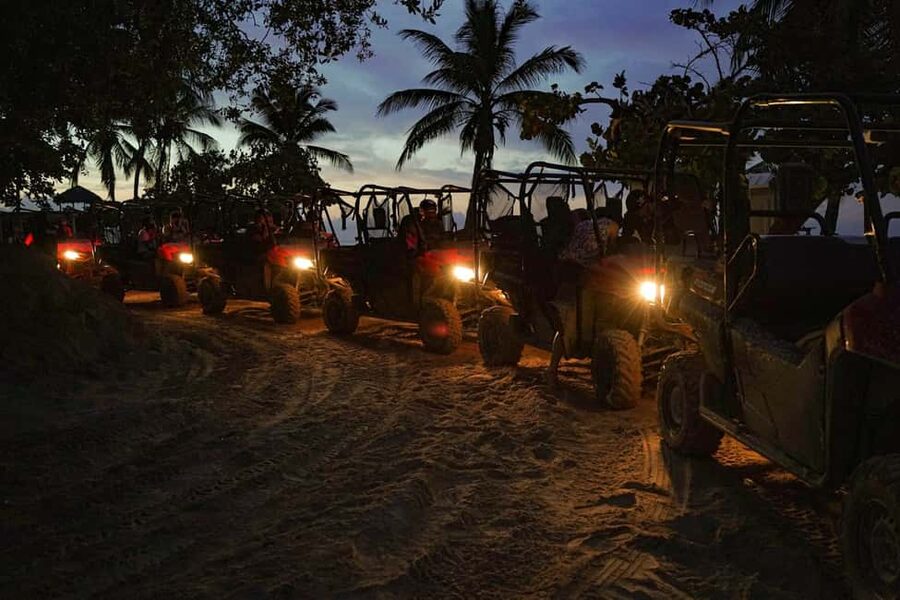 Punta Cana: Sunset Buggy Tour With Cave Swim and Dance Show - Entering the cenote after dark