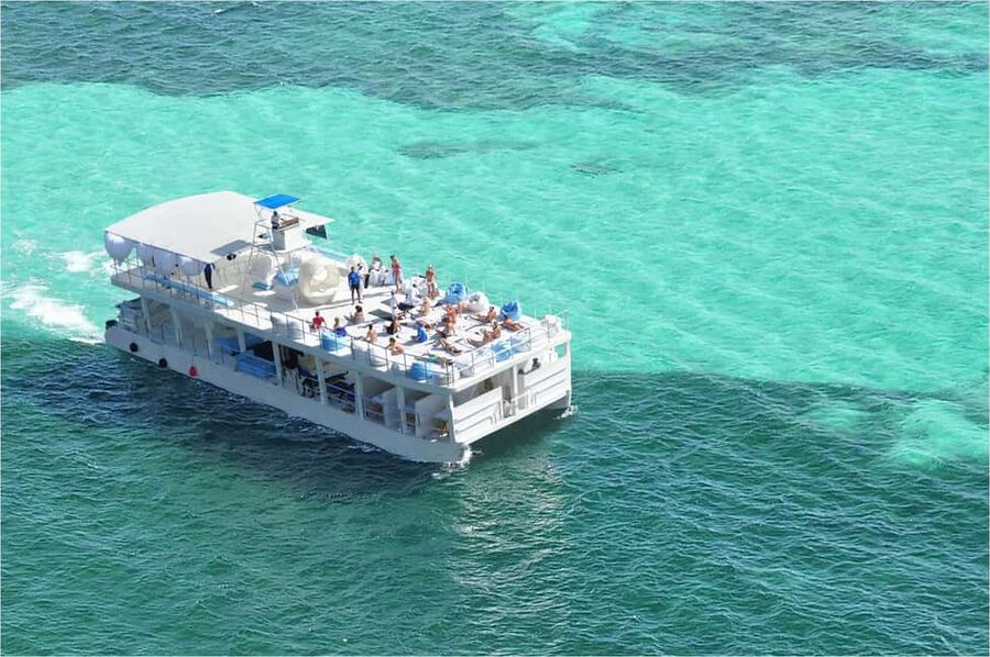 Sailing Splash Tour Speedboat, Snorkel, and Catamaran - Reef snorkeling among colorful fish