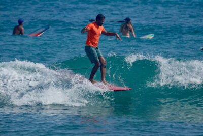 Surfing lesson at beautiful beach Playa Encuentro